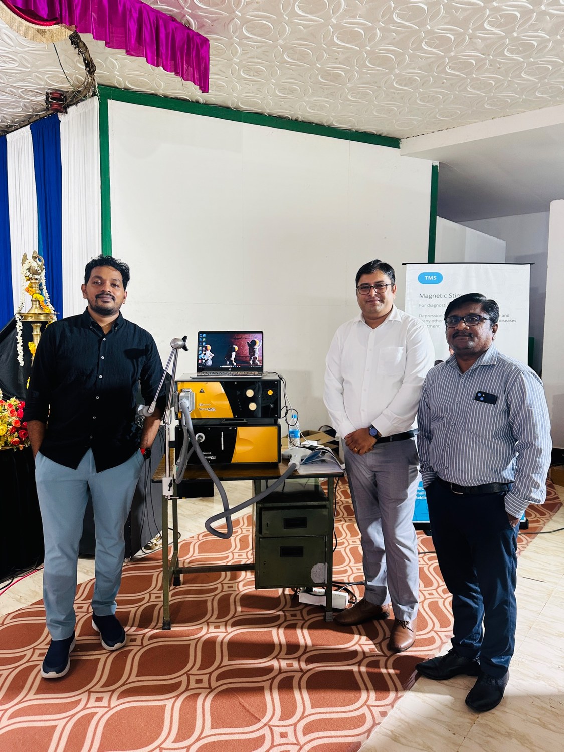Jithin Joseph with colleagues in a neuromodulation setting