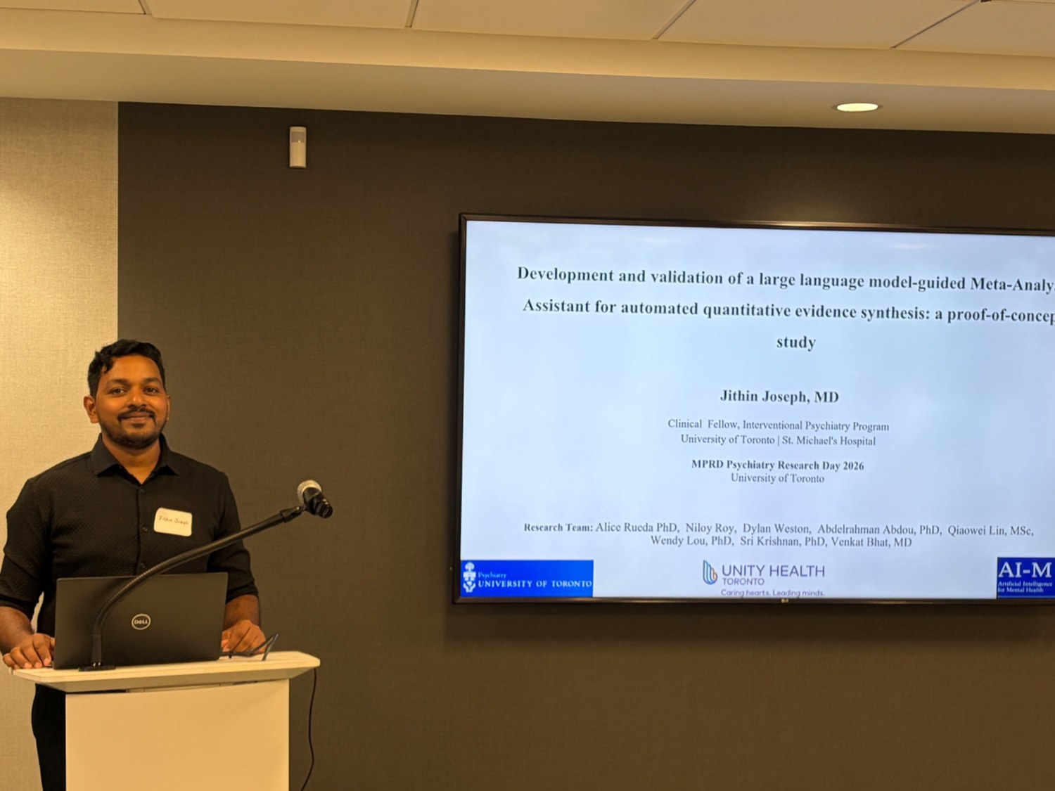 Jithin Joseph presenting research at a podium